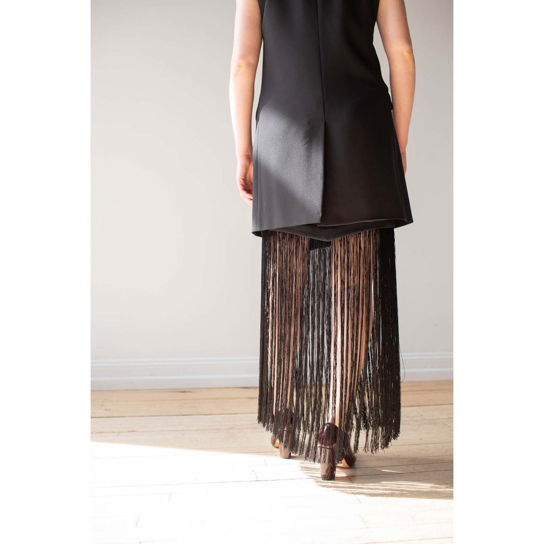 Nomia Asymmetric Fringe Skirt in Black